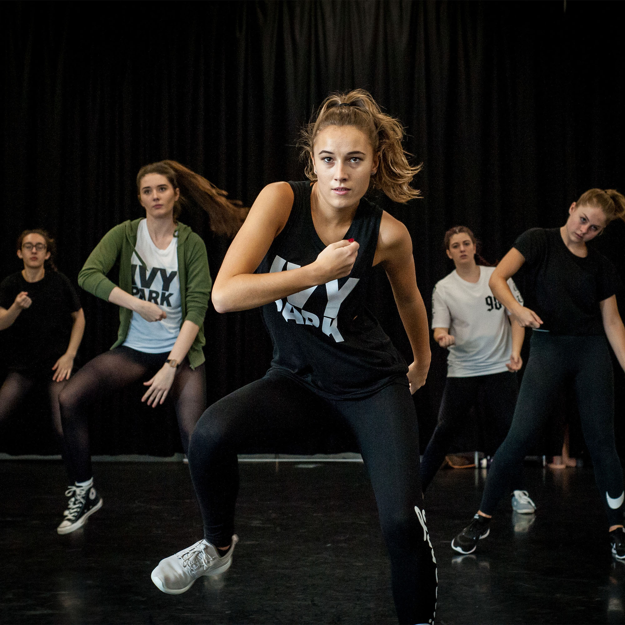 Students on Dance Level 6 course doing dance in studio at Oxstalls campus