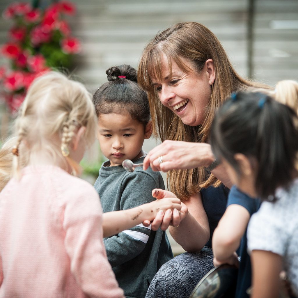 Student on the Working With Children, Young People and Families course playing with children