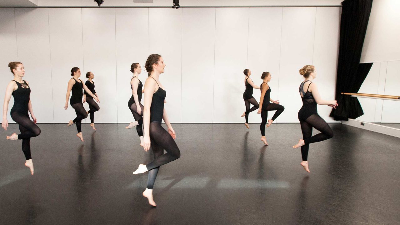 Dance students dancing together in a studio