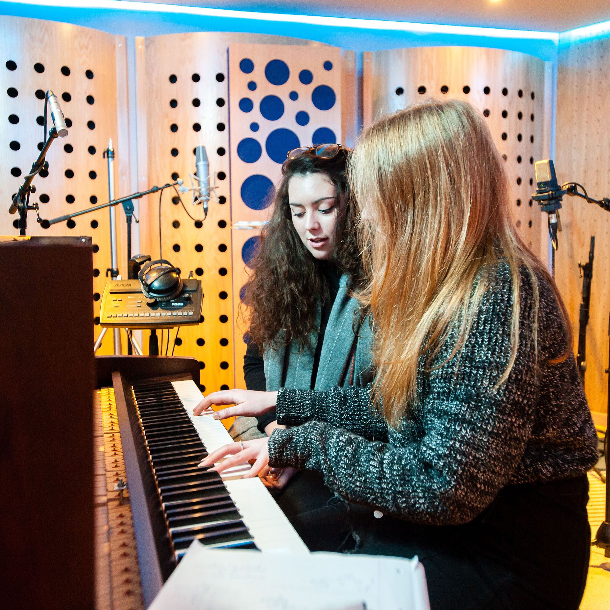 Students on the Music Business course playing a keyboard
