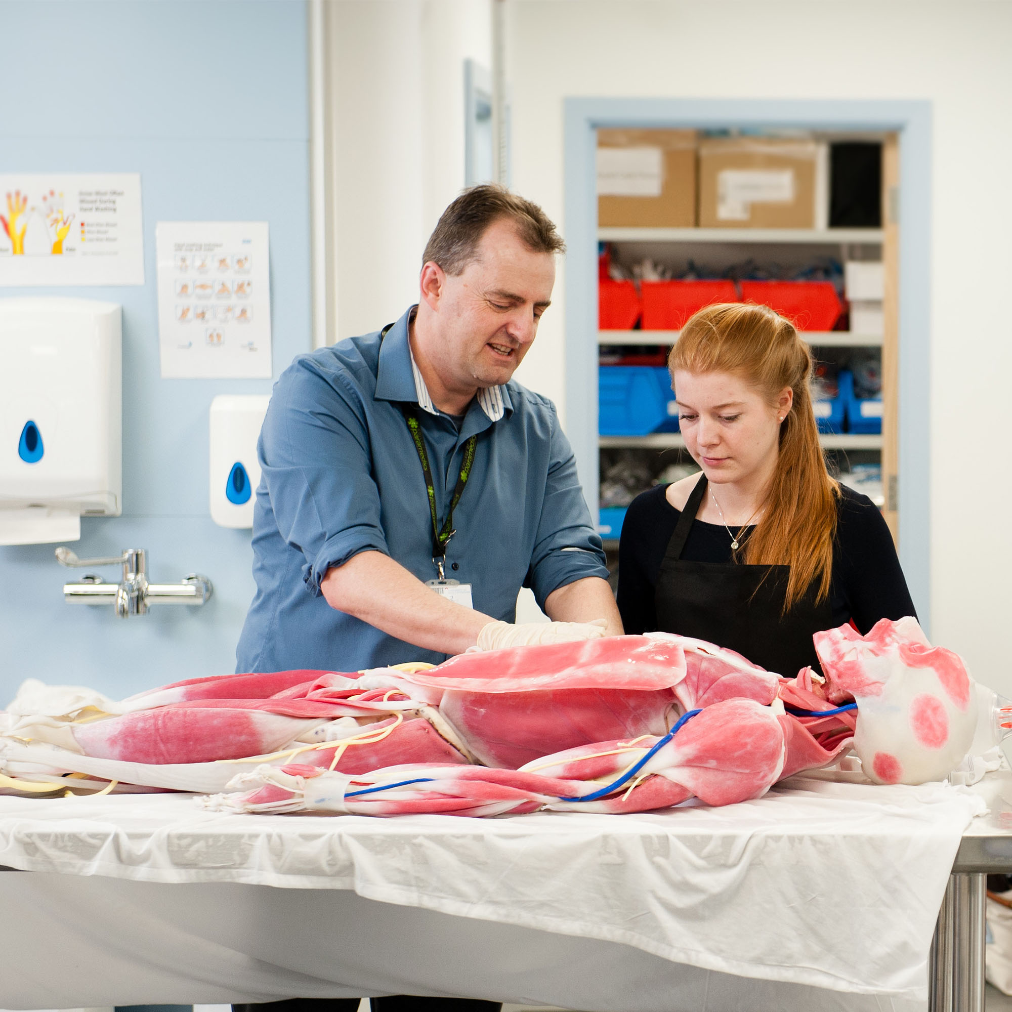 pas – health and social care – paramedic science Lecturer Keith Bromwich on the Paramedic Science course showing the fake cadaver to a student