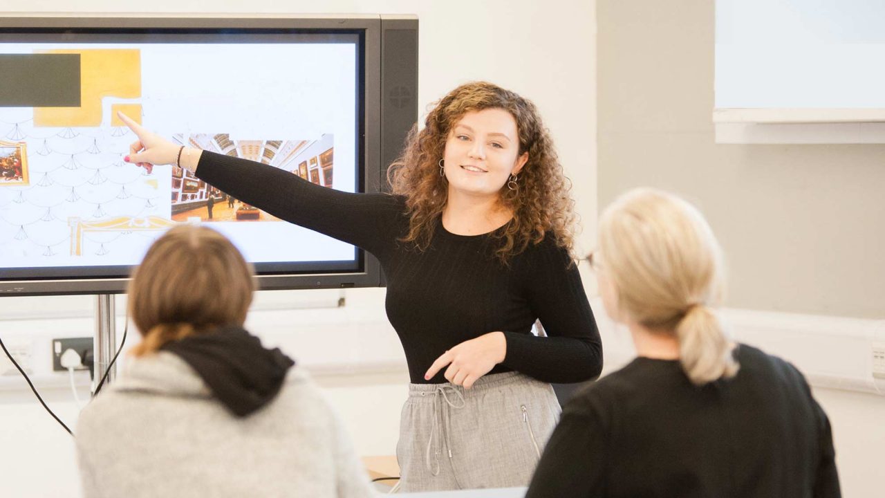 Student giving a presentation of their design work