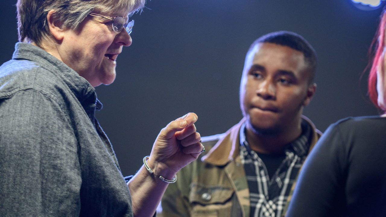 Sue Colverd 1 Lecturer talking to students under spotlights