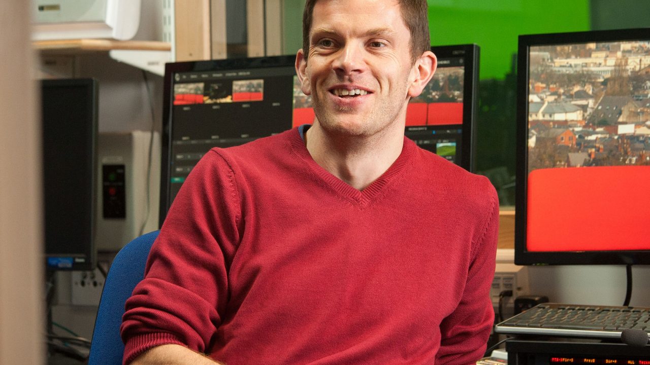 Tom Bradshaw 1 lecturer sat in media studio