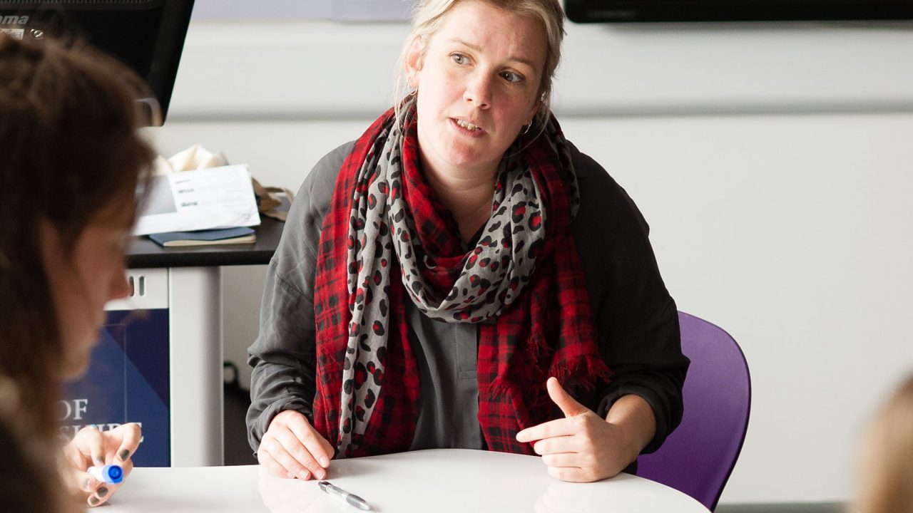 Lecturer with students