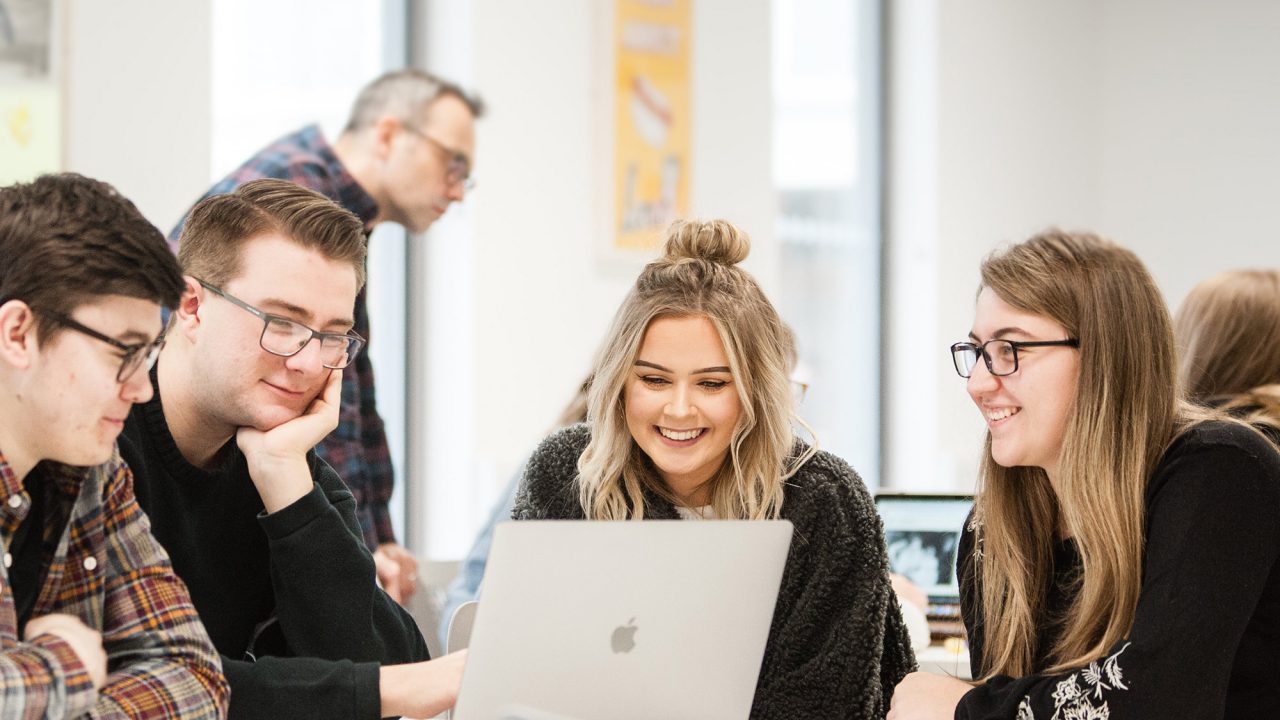 Students around laptop