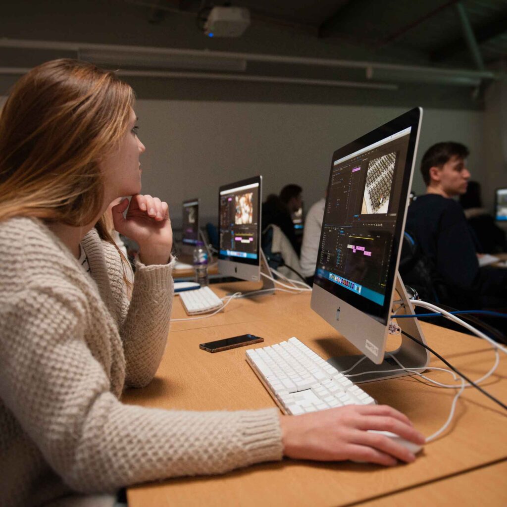 Student working in photography editing suite