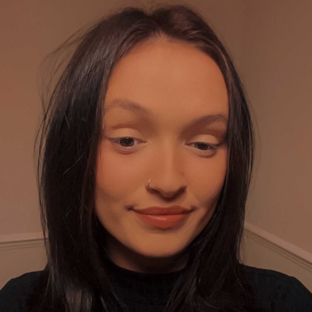 Head and shoulders photo of Chelsea smiling.