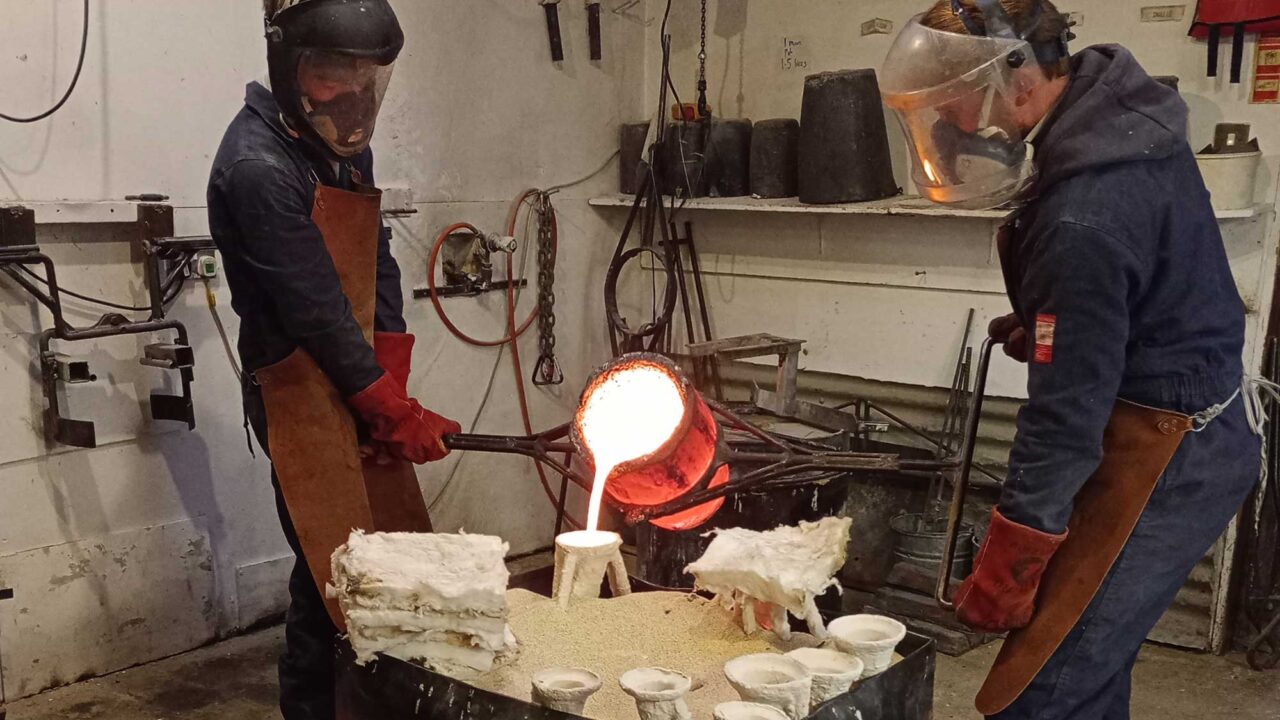 work-placements Two people use machinery to create a piece of artwork.