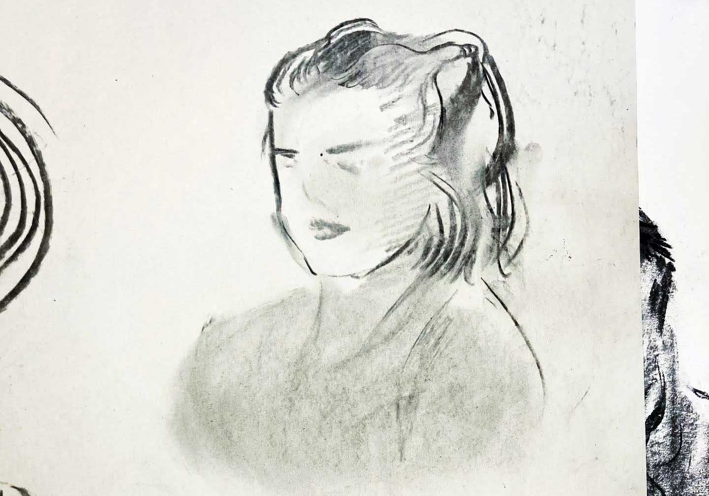 Charcoal drawing of a person's side profile, by current illustration student Zoe Reed.