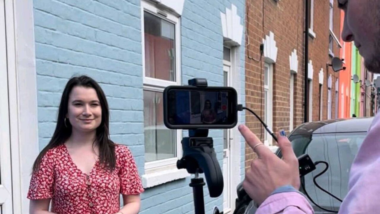 Female reporter talking to camera