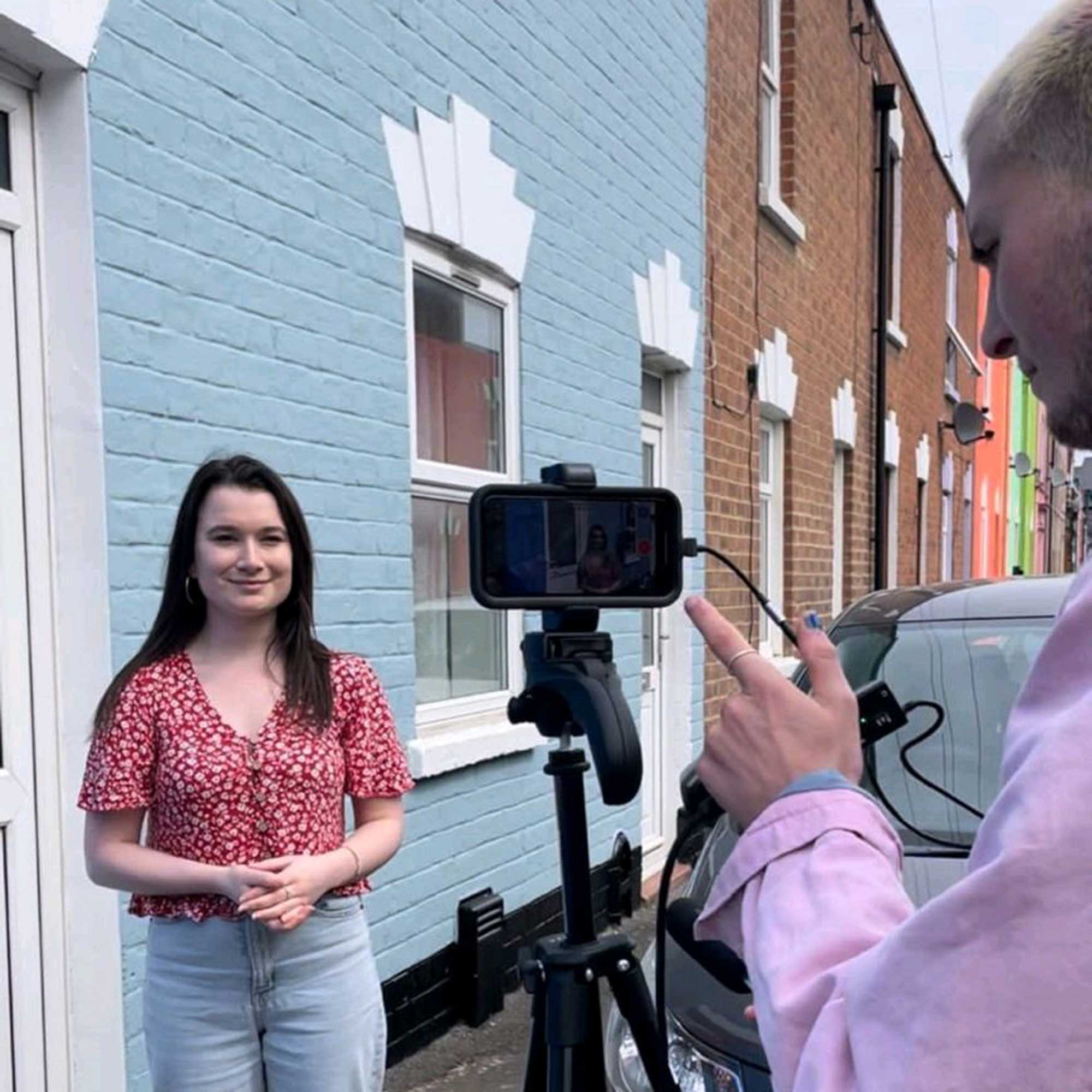 Female reporter talking to camera