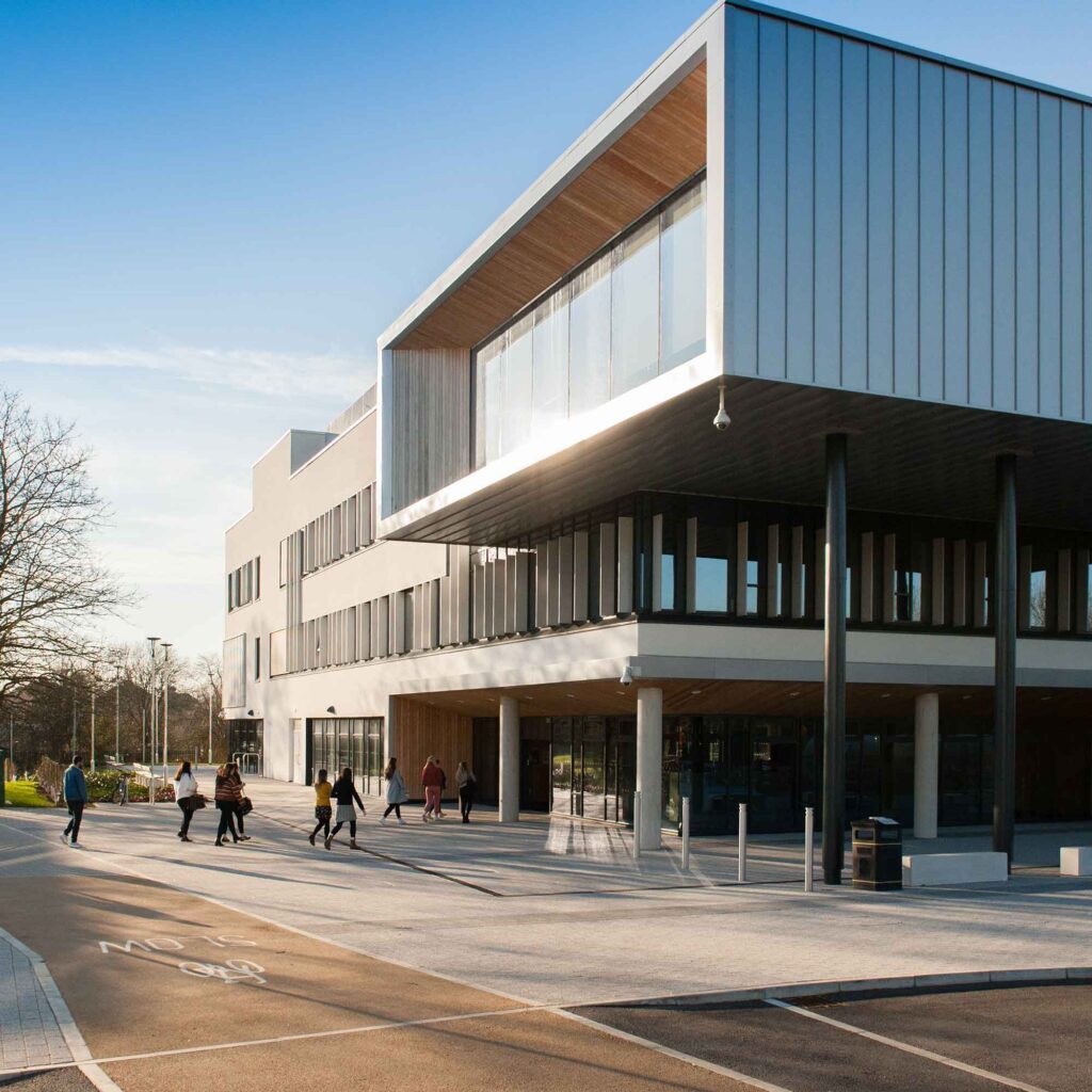 Students walking into the Business School at Oxstalls.