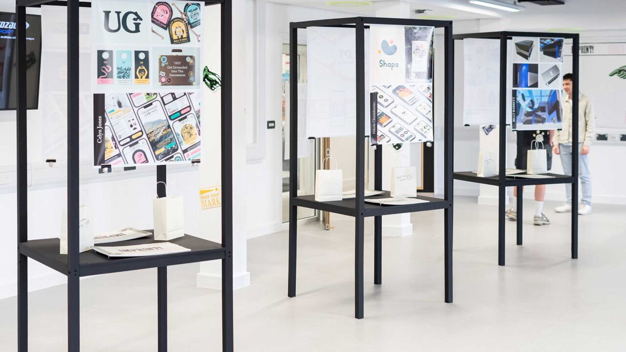 degree-show-2024-graphic-design Exhibition space showing three units displaying students' design work.