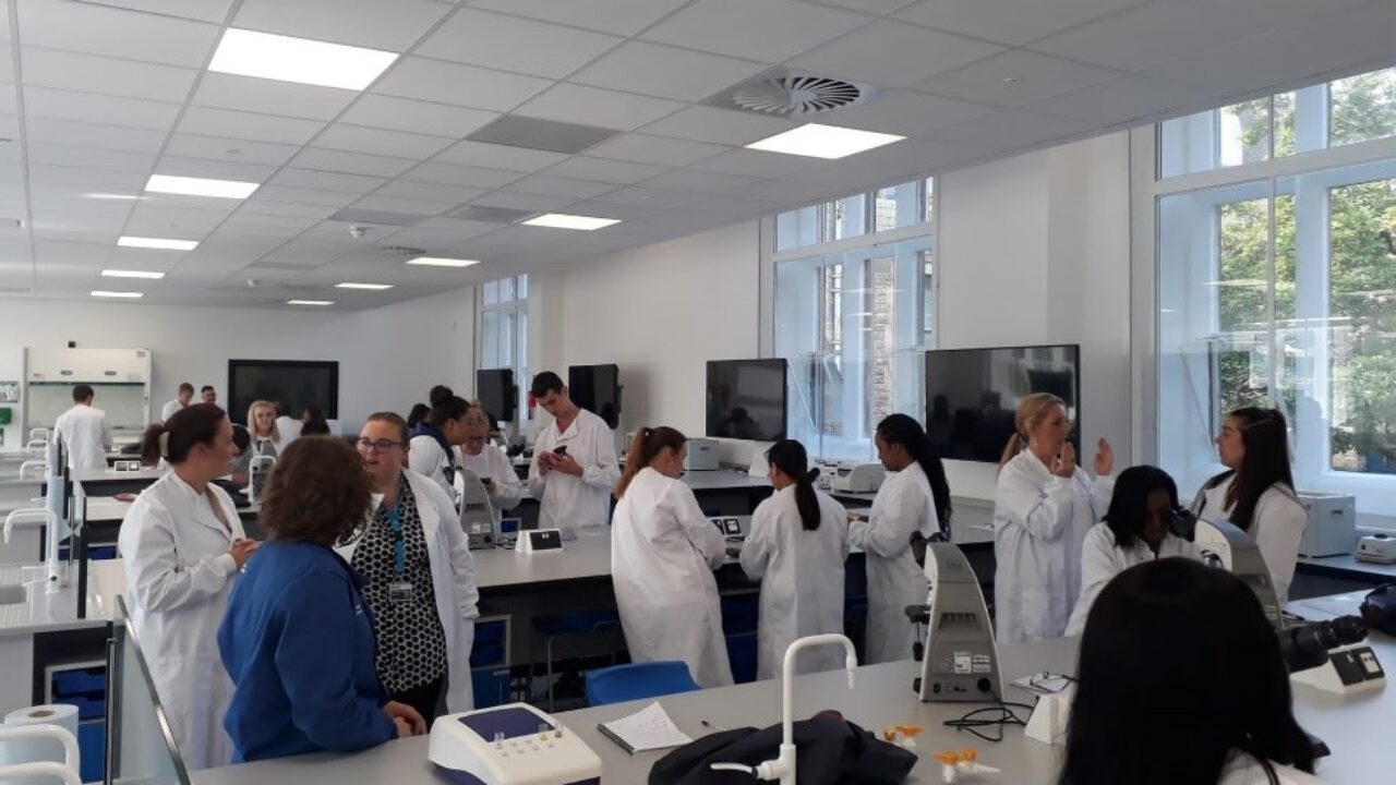 A lab showing students and staff working together.