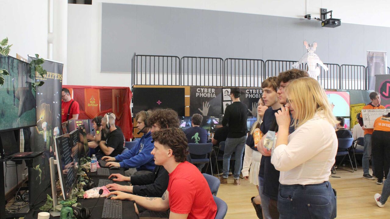 Students and guests at workstations at the annual Comx conference.