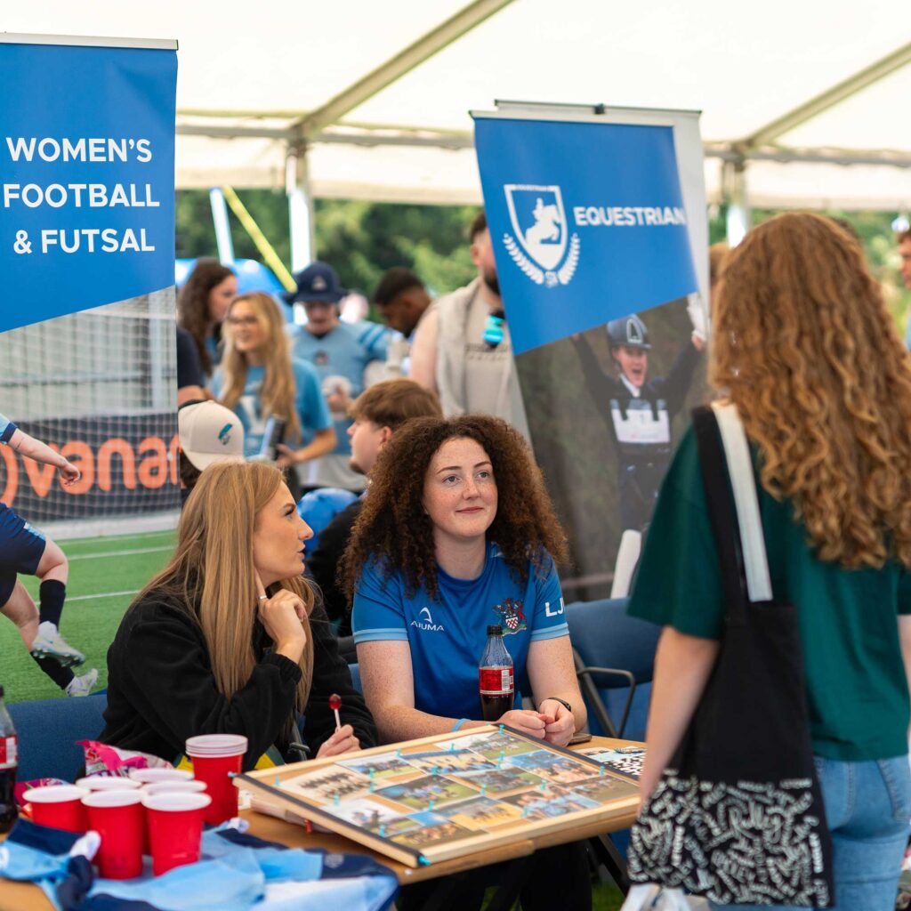 Students speak to sports society members at the Welcome Fayre.