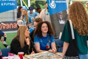 Students speak to sports society members at the Welcome Fayre.