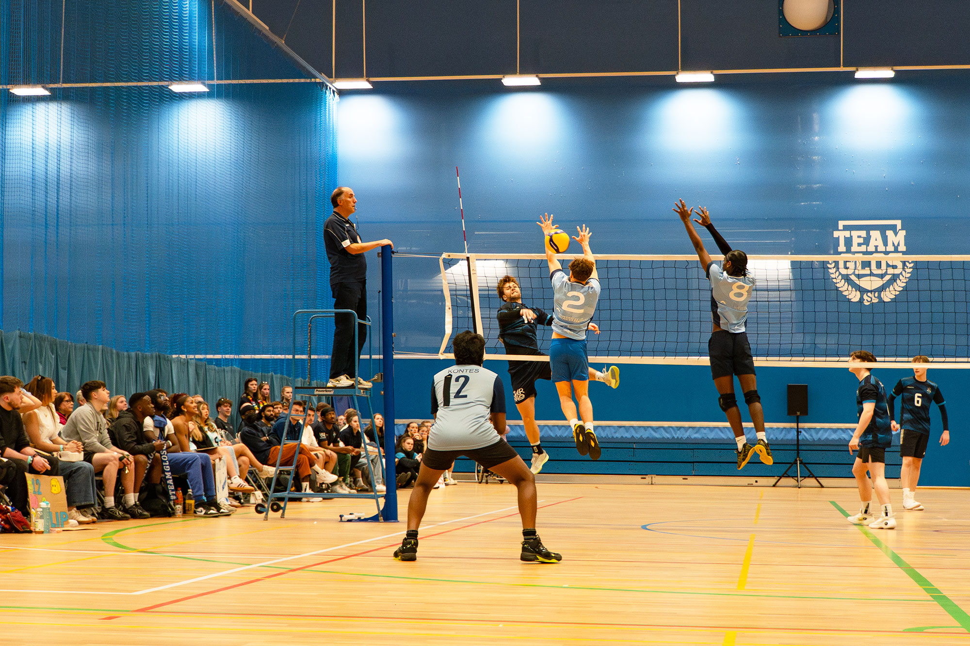 Men's volleyball team playing at the sports arena during Varsity 2025