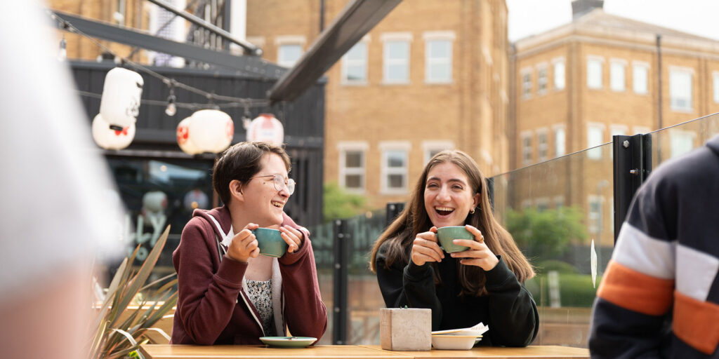 Students having a cup of coffee in Gloucester.