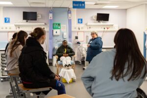 Students on an Outreach health and social care taster day in the mock hospital ward.