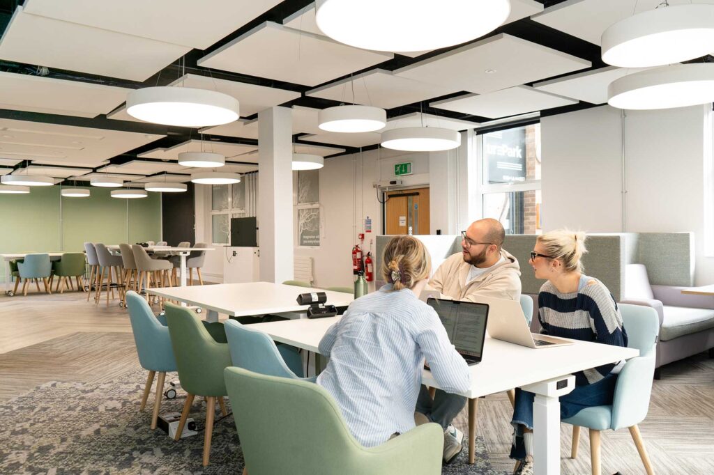 Students working on laptops in a break-out space in FuturePark.