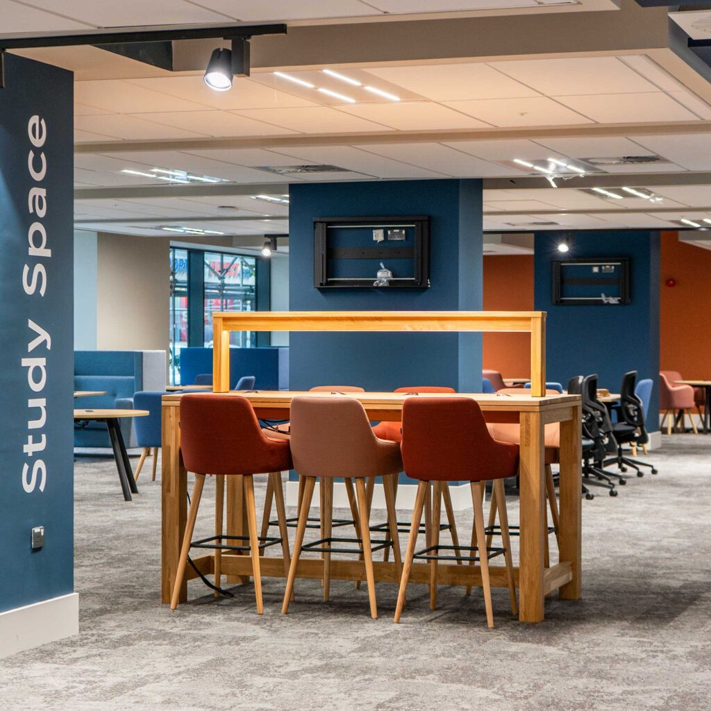 A study space within City Campus showing work areas.