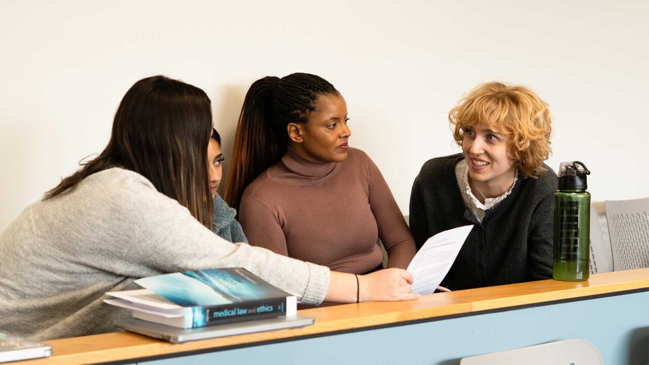 Students sat in a law lecture discussing a case.