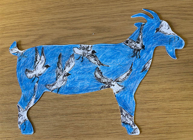 A goat postcard decorated with white birds on a blue background.