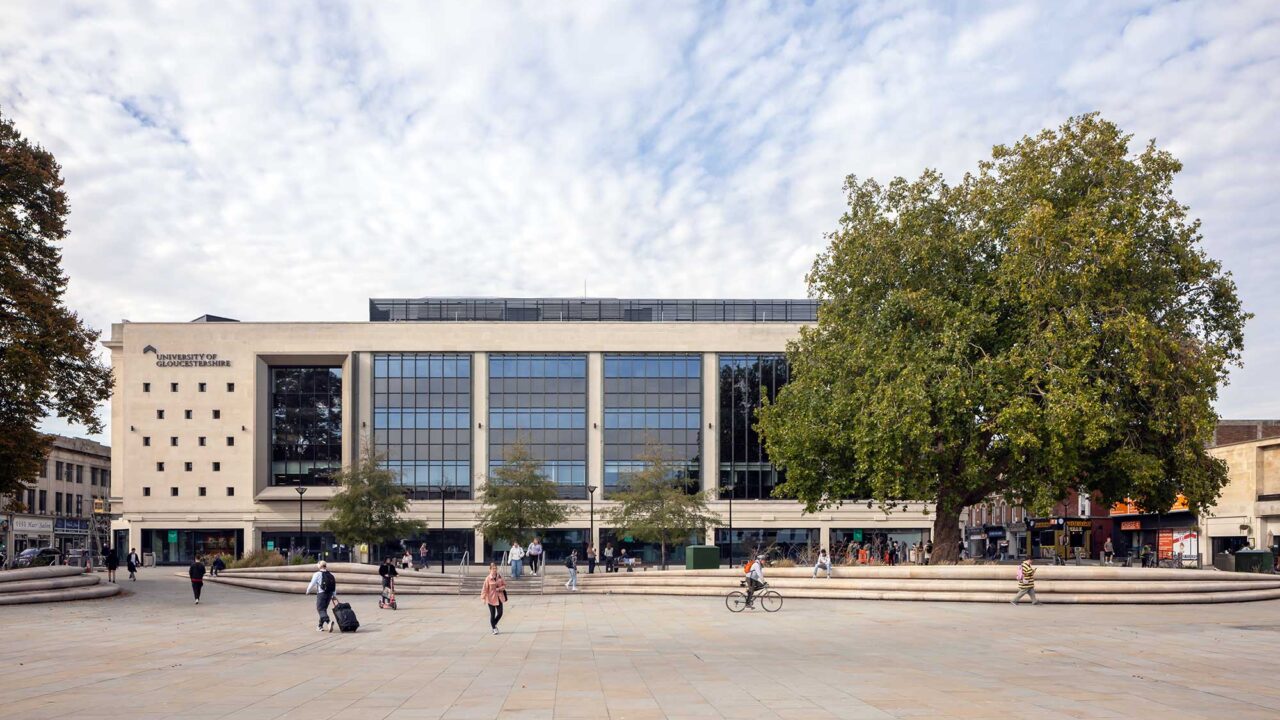 View of City Campus across Kings Square with people walking and cycling.