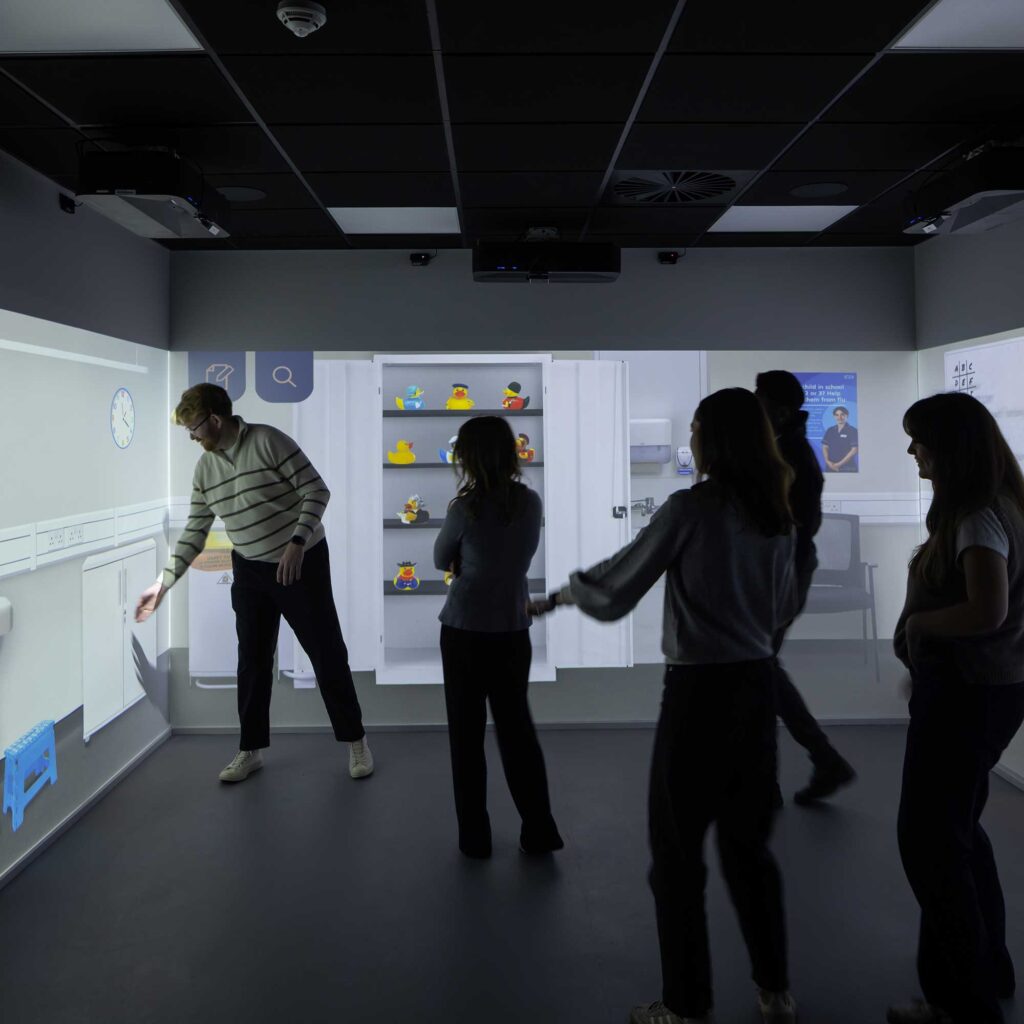 Students in the immersive room with at City Campus.