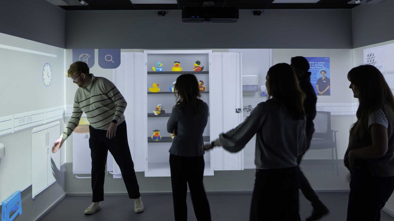 Students in the immersive room with at City Campus.