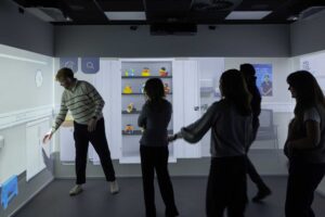 Students in the immersive room with at City Campus.