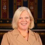 Head and shoulders photo of Clare Marchant smiling.