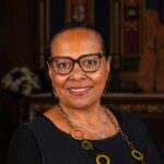 Head and shoulders photo of Elonka Soros smiling.