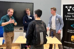 Students and employers talk to each other at the Cyber and Digital Launchpad event.