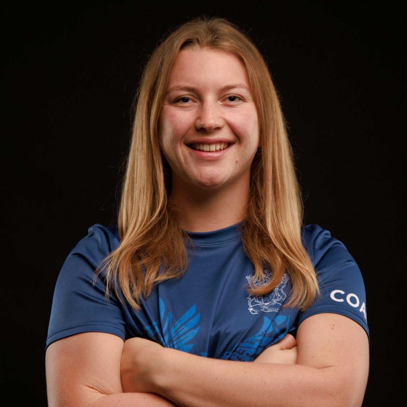 Head and shoulders photo of Janine Taylor wearing netball kit.