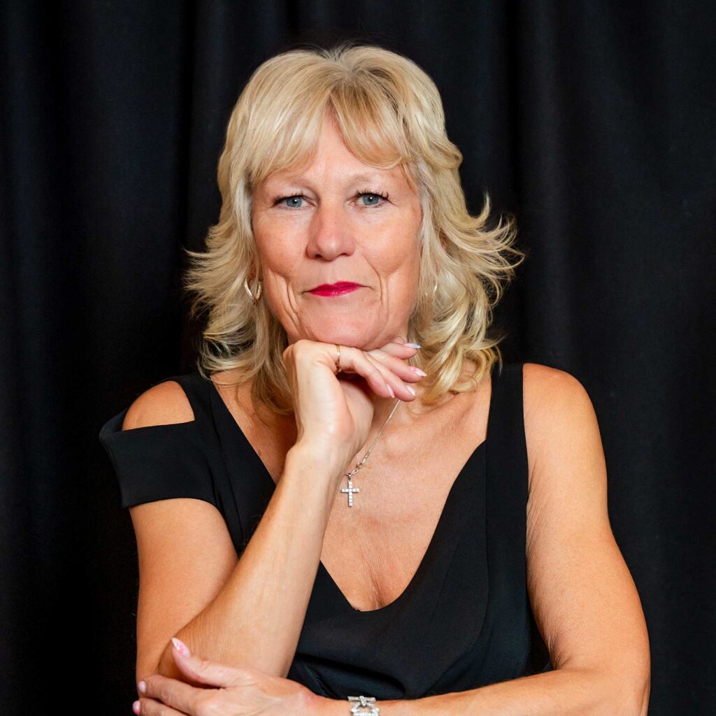 Head and shoulders photo of Julie Kent smiling.