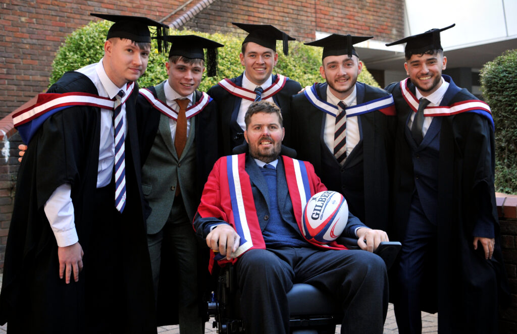 Ed Slater, Honorary Fellow, with five University of Gloucestershire graduates.