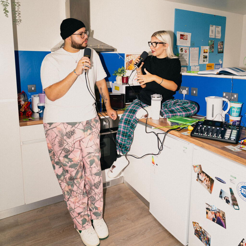 Hesham and Ivana recording a podcast in a student kitchen