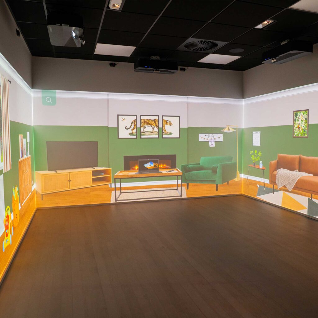 City Campus' immersive room with a virtual living room set up projected onto all walls.