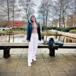 Manpreet Kaur standing in front of a water feature on Oxstalls Campus.