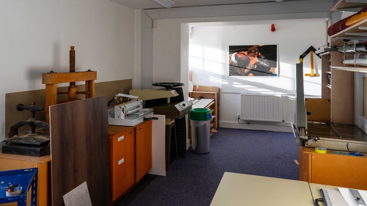 An interior of a room used for printmaking with presses and other equipment.