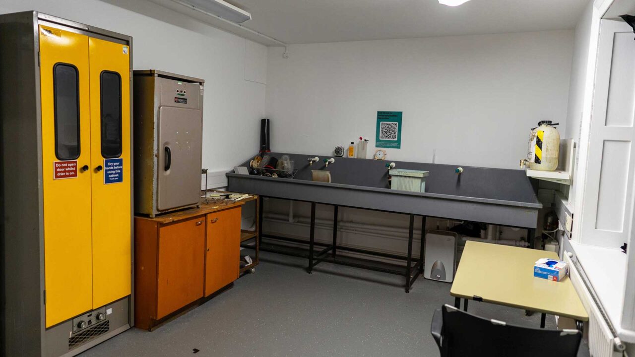 A room used for developing photographs with sinks and specialist cupboards.