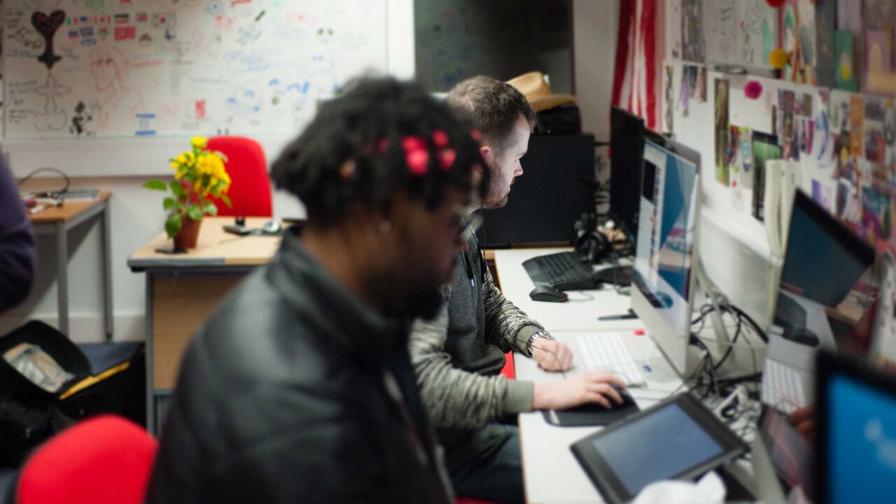 Students working alongside each other in the animation studios.