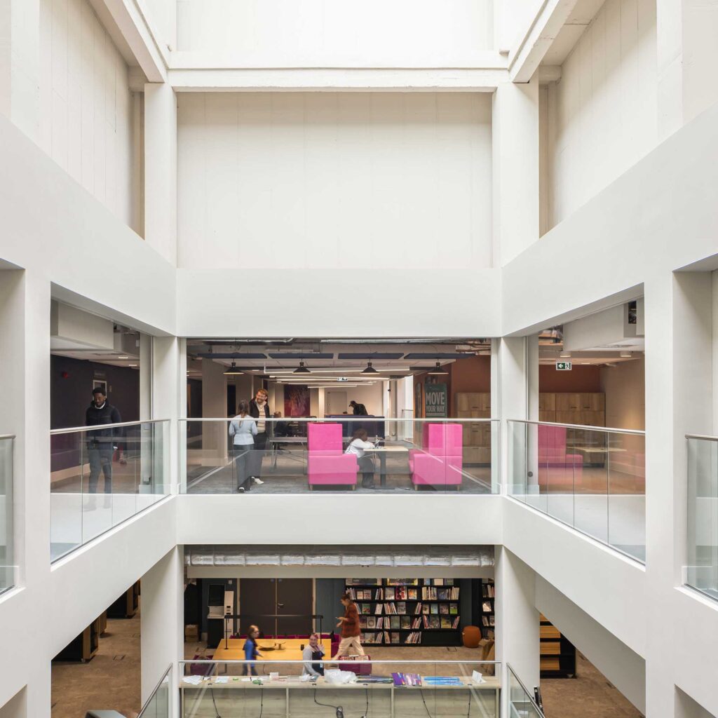An interior view of City Campus showing the lightwell and library on the ground floor.