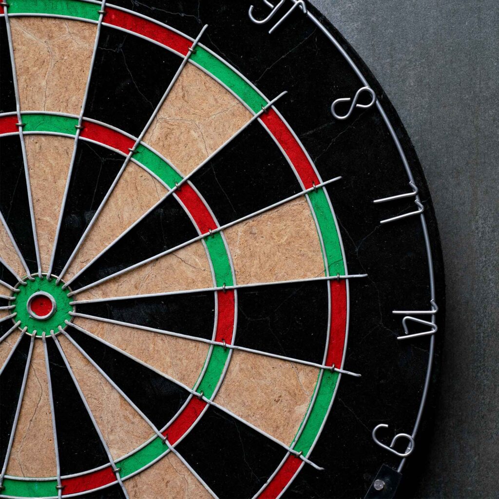 Darts board on a wall.