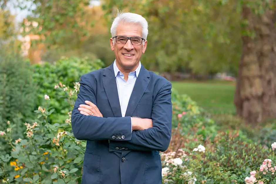 Reverend Canon Steve Chalke MBE, founder of the Oasis Trust smiling with his arms folded.