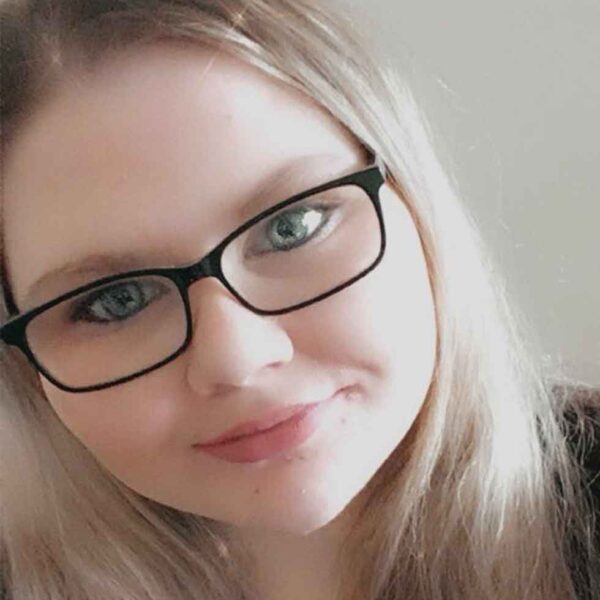 Photo of River smiling.