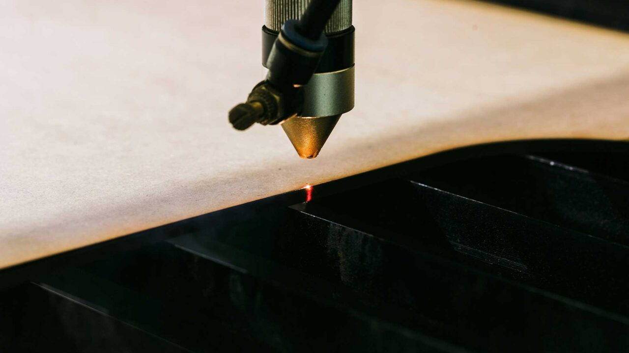 A close-up image of a laser-cutting machine tool.